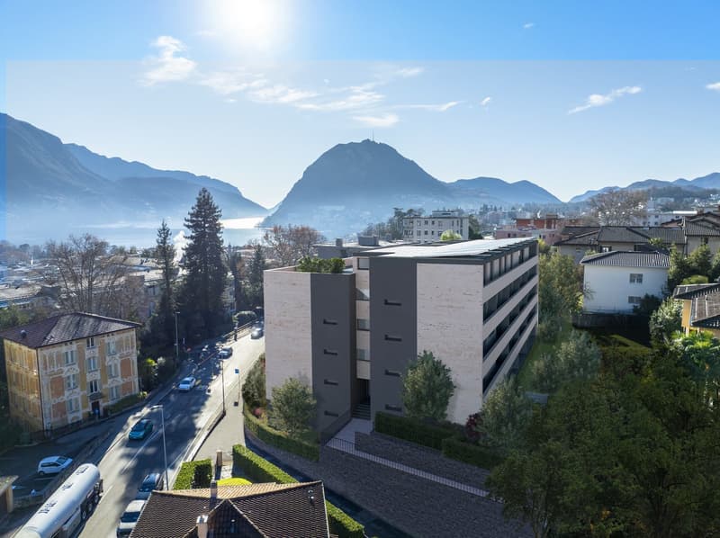 Modern apartment building with a view of the mountains and the city