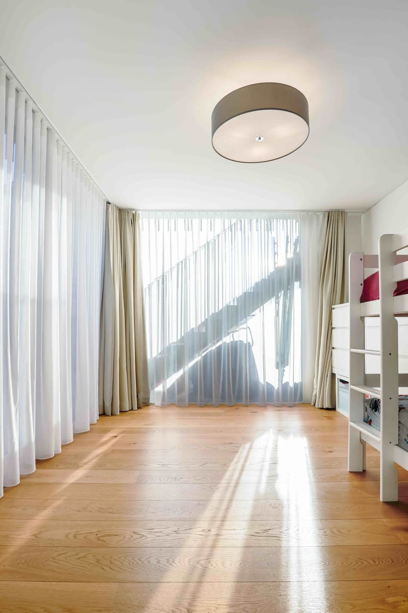 modern room, hardwood floor, white ceiling, white walls, bunk bed, ceiling lamp, curtains, windows
