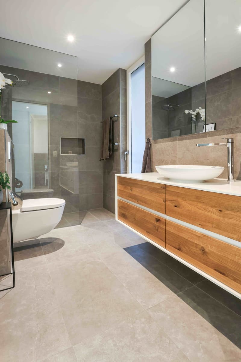 bathroom with shower, toilet, vanity, tiled floor