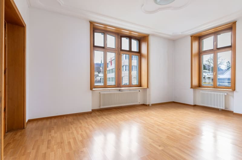 empty room, wooden floor, white walls, wooden windows, ceiling with decoration, white radiators