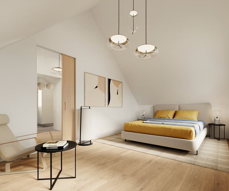 Bedroom with wooden floor, white walls, bed with yellow sheets, bedside tables, lamps, rug, and a chair