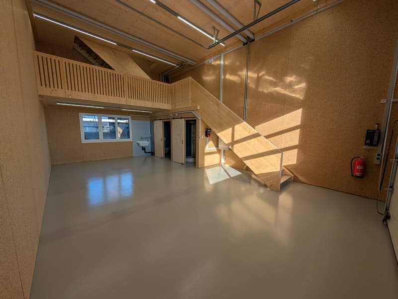 empty room, white floor, wooden stairs, wooden balcony, white ceiling lights, fire extinguisher