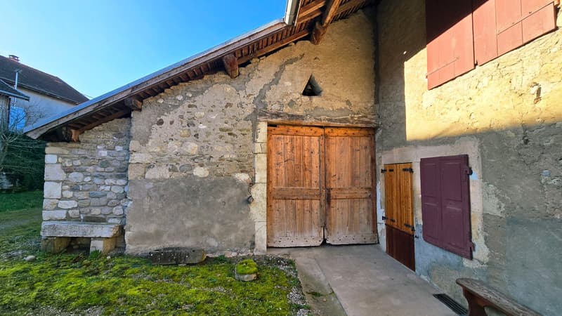 Stone house, wooden doors, wooden shutters, stone bench, mossy grass, wooden bench