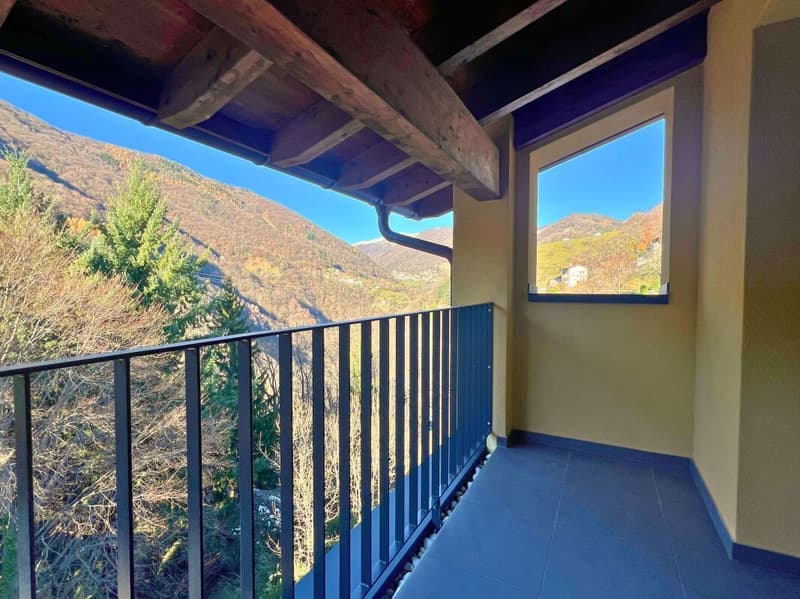 Attico moderno di 3.5 locali con balcone, vista e due posti auto (9)