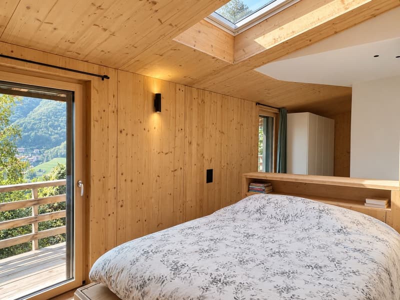 Modernes Holzhaus mit viel Privatsphäre und grossen Fensterfronten mit Blick ins Grüne (6)