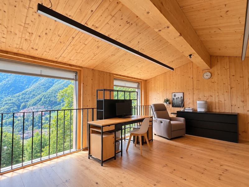 Modernes Holzhaus mit viel Privatsphäre und grossen Fensterfronten mit Blick ins Grüne (10)