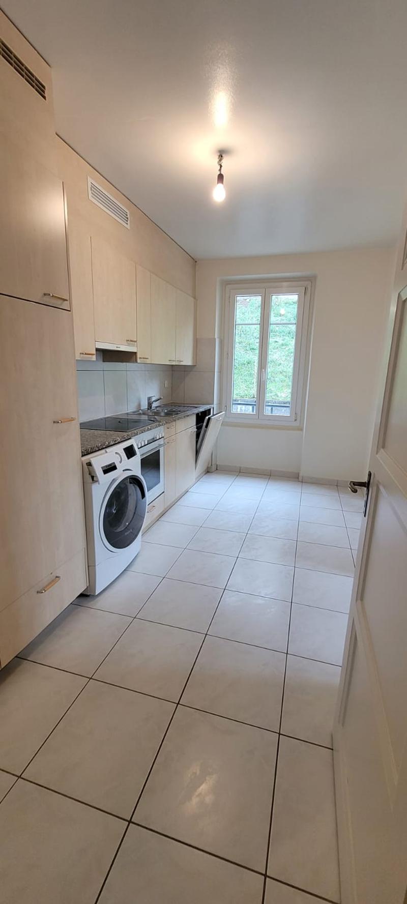 Kitchen, washing machine, tiled floor, sink, window