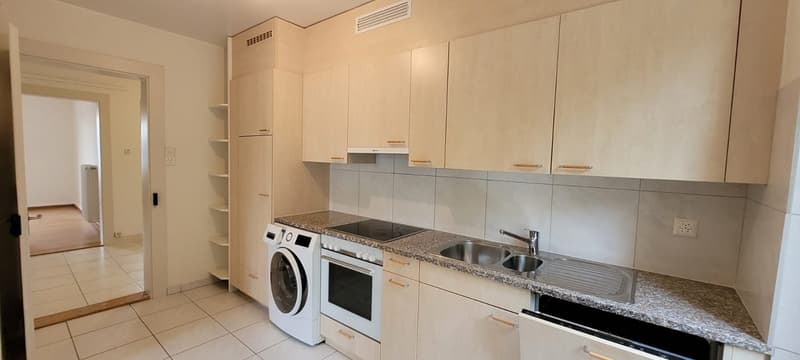 kitchen, washing machine, oven, countertop, cabinets, power outlet, sink, faucet