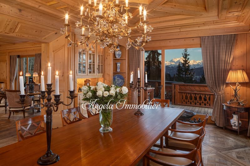 dining room, wooden floor, chandelier, dining table, chairs, flower vase, balcony, mountain view