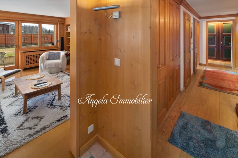 wooden floors, wooden wall, hallway, chairs, coffee table, radiator, sliding glass door, outdoor views