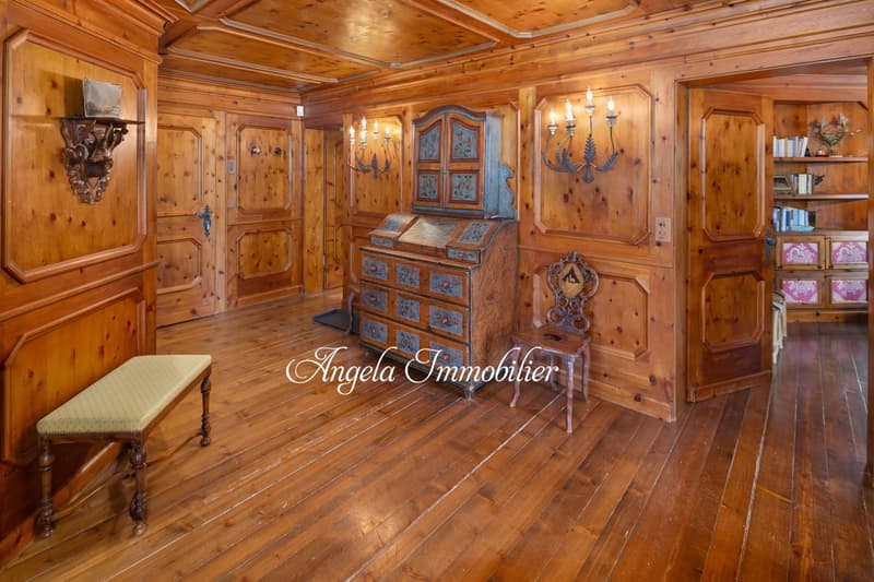 wooden walls, wooden floor, antique furniture, decorative wall sconces, wooden bench, wooden chair, wooden cabinet