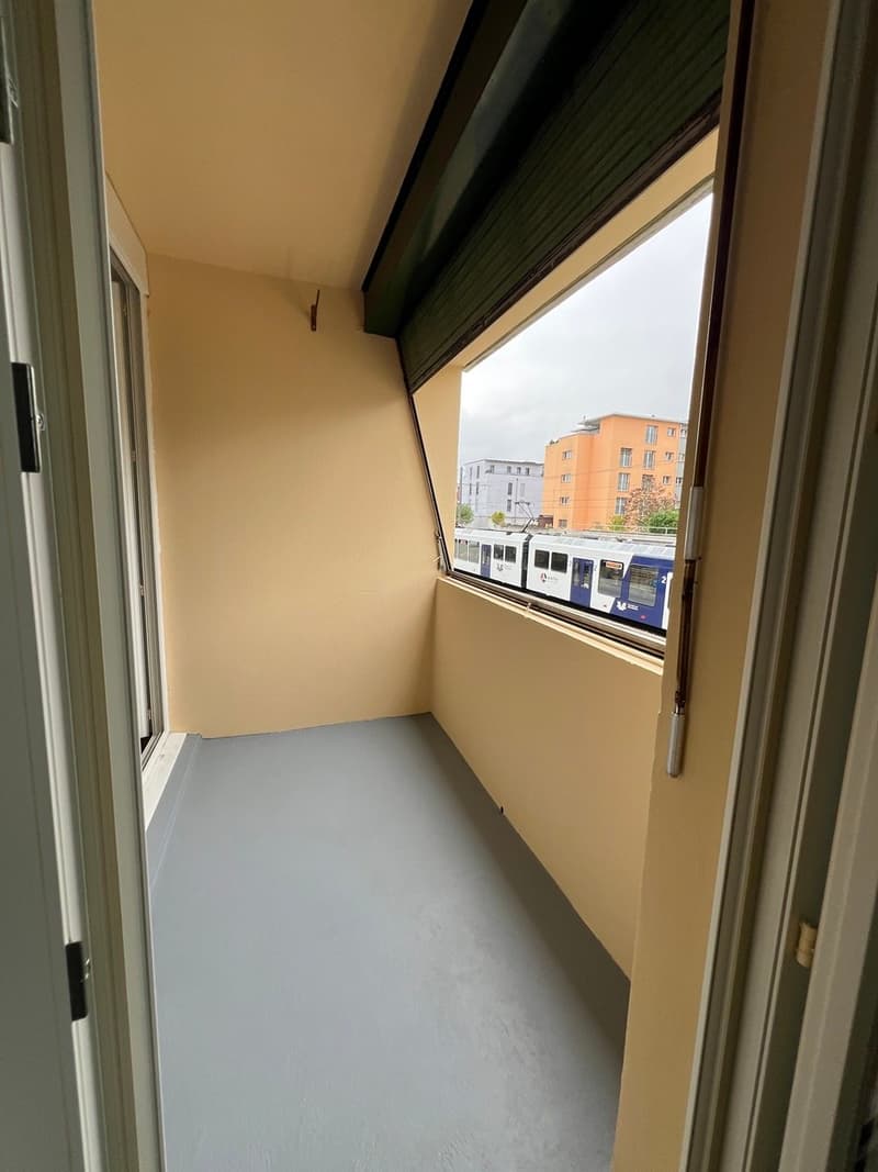 empty balcony with a view of a train
