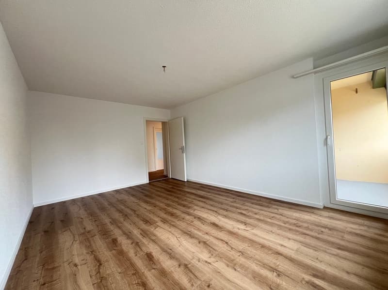 empty room, wooden floor, white walls, open door, sliding glass door