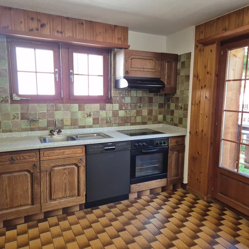 kitchen with wooden cabinets, tiled wall, double sink, modern stove, dishwasher, windows with curtains