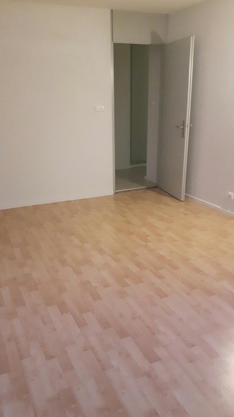 empty room, wooden floor, white walls, open door, power outlet
