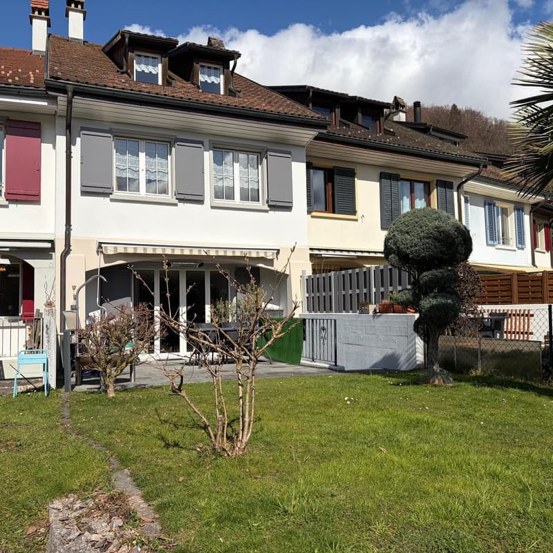 3 story house, brown roof, white walls, red shutters, balcony, garden, trees
