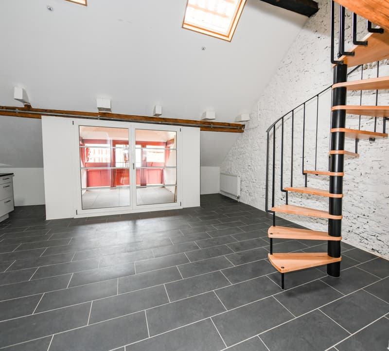 dark tiled floor, white wall, wooden staircase, sliding glass door