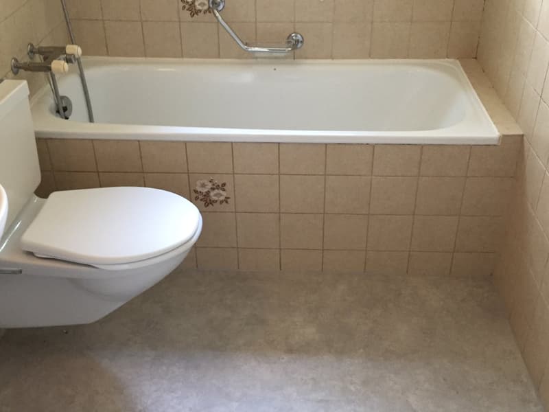 Bathtub, toilet, tiled walls, floor