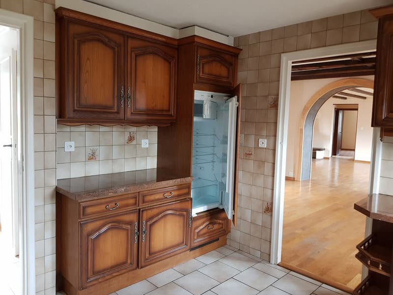 kitchen, wooden cabinets, countertop, open refrigerator, tiled walls