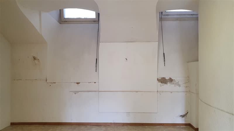 empty room, arched ceiling, white walls, outlets on wall, 2 windows