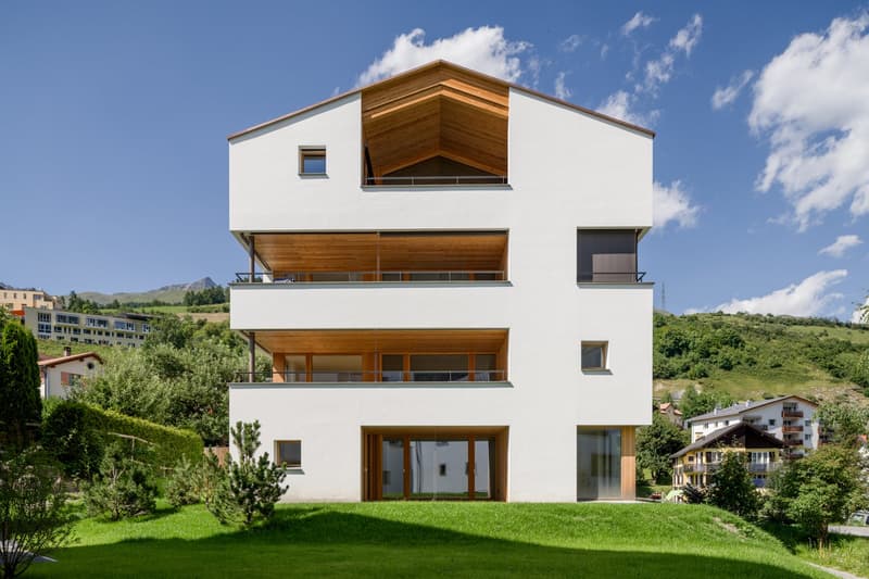 Modern 3 story house, white facade, wooden terrace, large glass windows, wooden roof