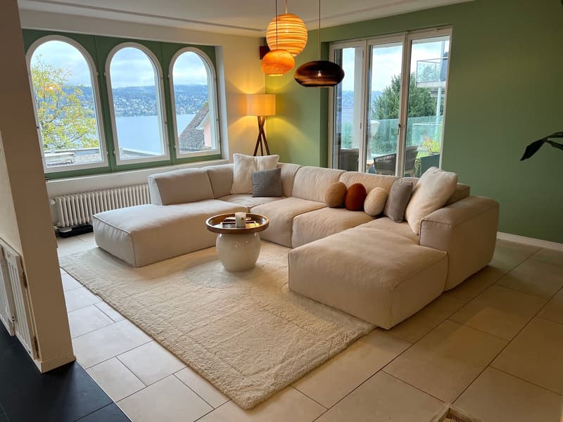living room with direct access to private garden and panoramic lake views