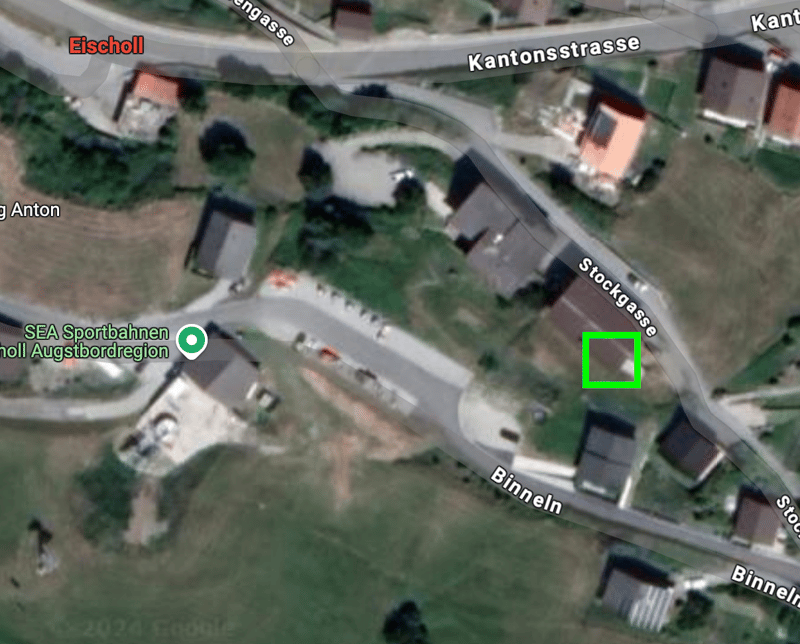 Aerial view of a location with various buildings, road markings, and street names including Eichschol, Kantonsstrasse, and others.