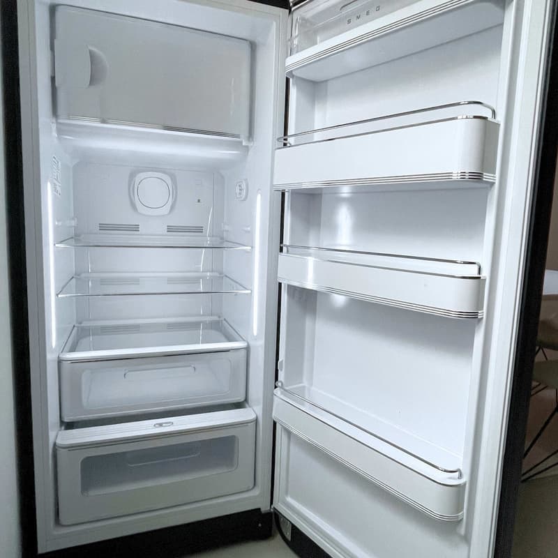 Modern white refrigerator, separate freezer section, glass shelves, water dispenser, ice maker, stainless steel handles, electronic control panel, water and ice dispenser