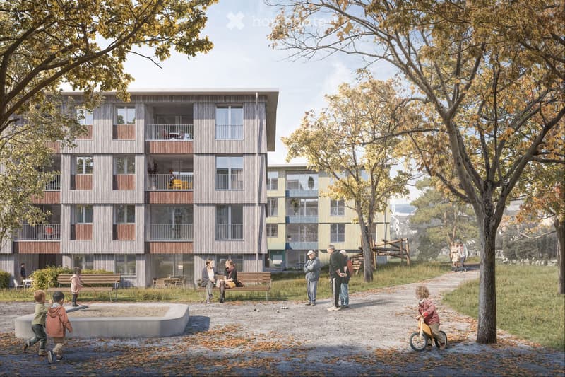 Multi-story apartment building with wooden and glass facade, balconies, surrounded by trees and a park-like setting with benches and people walking around