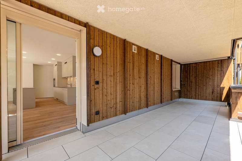 {"visible_features": [],    "type": "Room",    "description":"Empty room with wooden walls, tiled floor, and a glass door opening to another room.",    "localized_descriptions":        {        "EN": "Empty room with wooden walls, tiled floor, and a