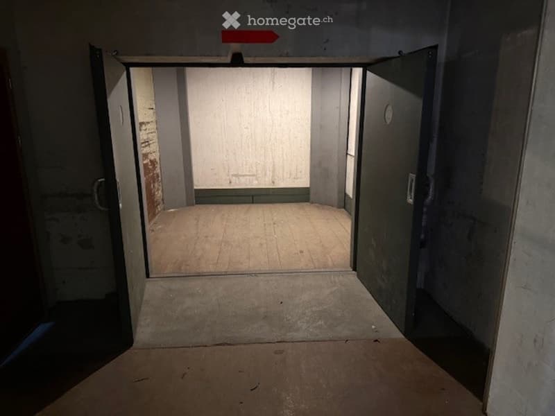 Unfurnished empty room, concrete wall, wooden floor, open door
