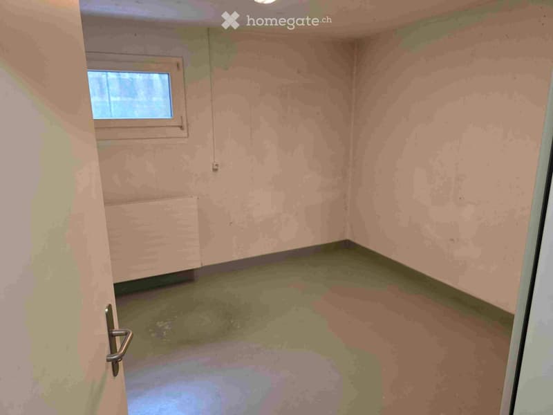 {"visible_features":[],"type":"Room","description":"Unfinished room with concrete floor, bare walls, and a small window. The room appears to be in a state of renovation or construction."}