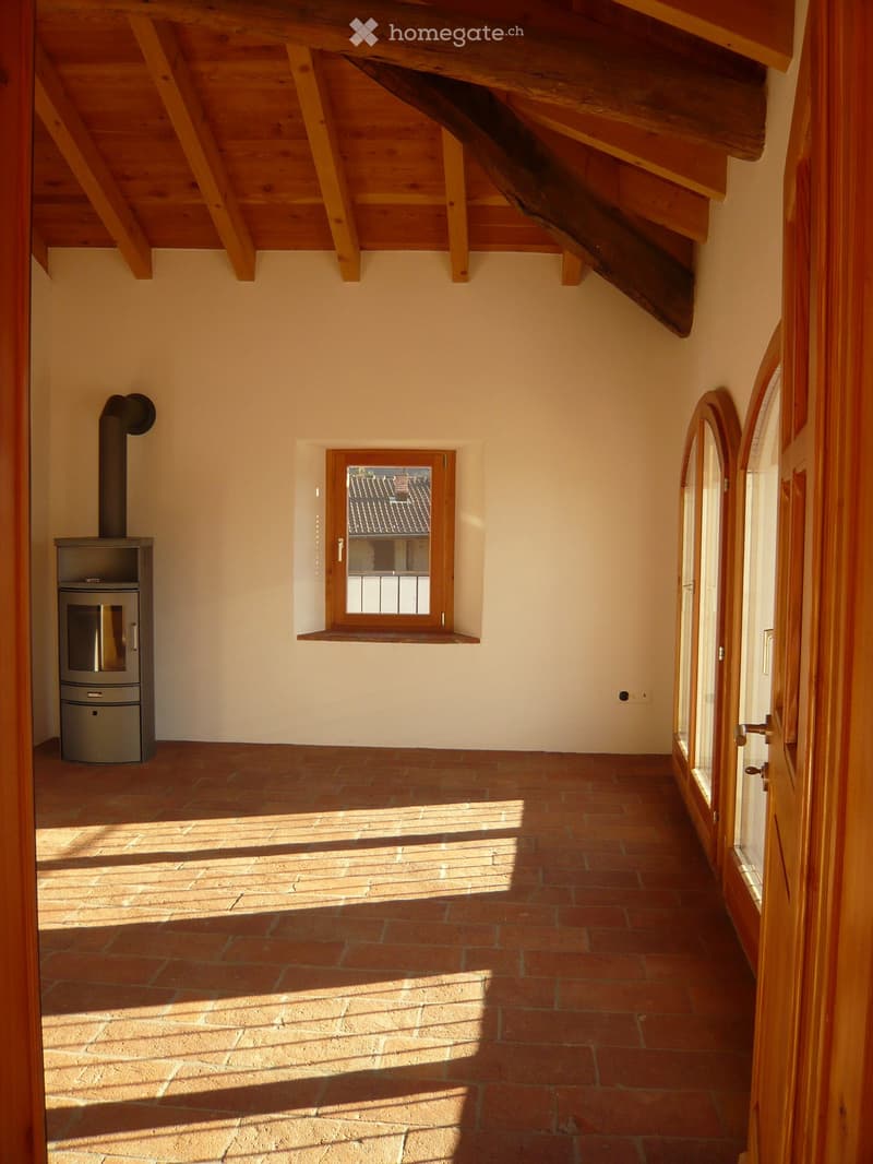 wooden ceiling, brick floor, fireplace, window, wooden floor