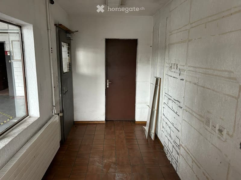 tiled floor, two doors, window, white walls