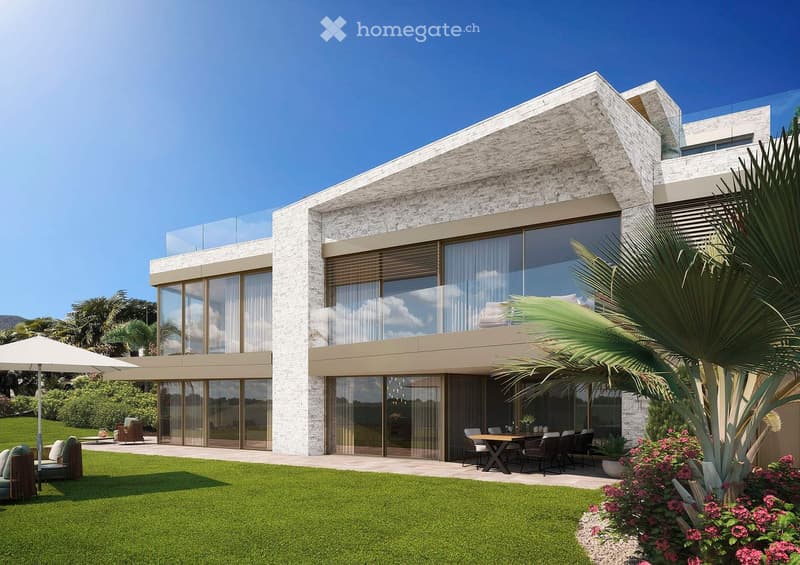 Modern house, white stone, large glass windows, outdoor dining area, garden, green grass, palm tree