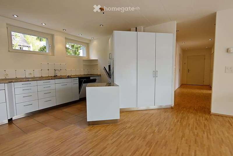 modern kitchen, white cabinets, marble countertop, modern appliances, wooden flooring, windows, neutral colors