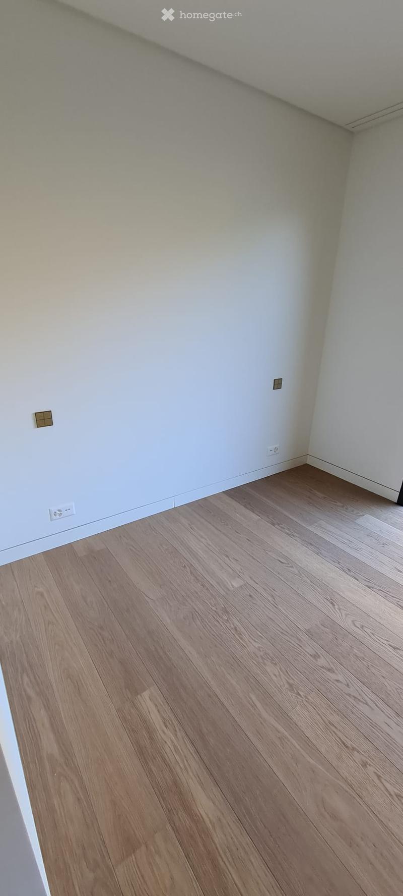 empty room, hardwood floors, white walls, outlets