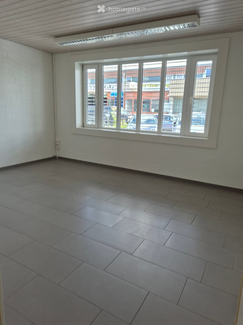 empty room, tiled floor, windows with shutters, bright lighting