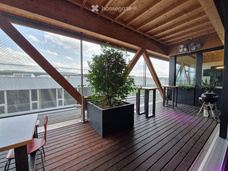 wooden floor, large windows, trees, tables, chairs, railings, grill