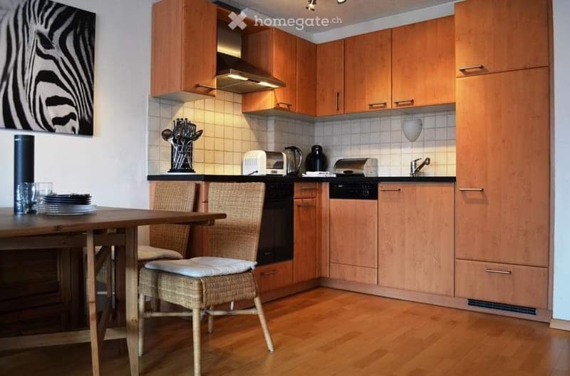 wooden cupboards, wooden table and chairs, kitchen appliances, open shelving, tiled backsplash