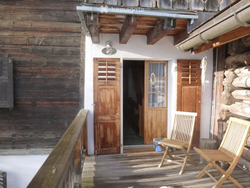 wooden exterior, open balcony, wooden doors and windows, street light