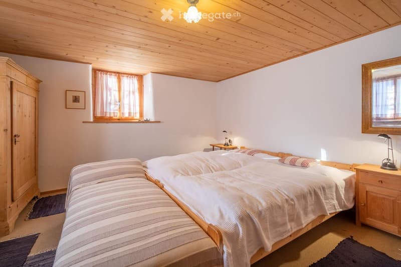 wooden floor, wooden ceiling, bed, bedside tables, window, wardrobe, carpet