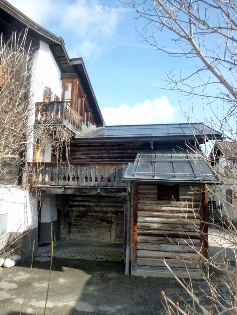 Alpine-style wooden house, large garage with entrance, balconies, solar panels