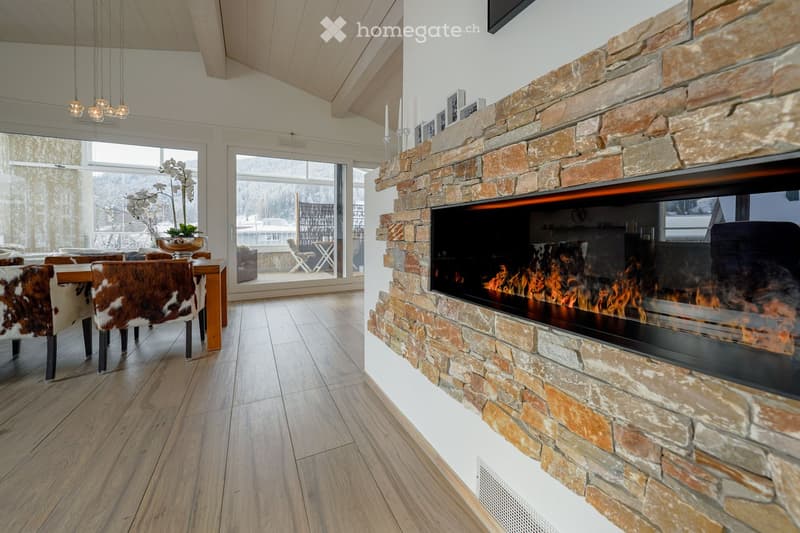 modern fireplace, dining table, cushioned chairs, chandeliers, outdoor view