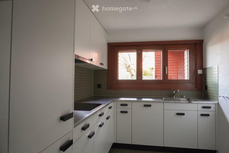 modern kitchen, white cabinets, tile flooring, large windows