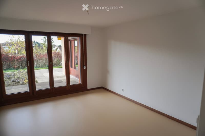 sliding glass doors, empty room, beige flooring, white walls, door to balcony