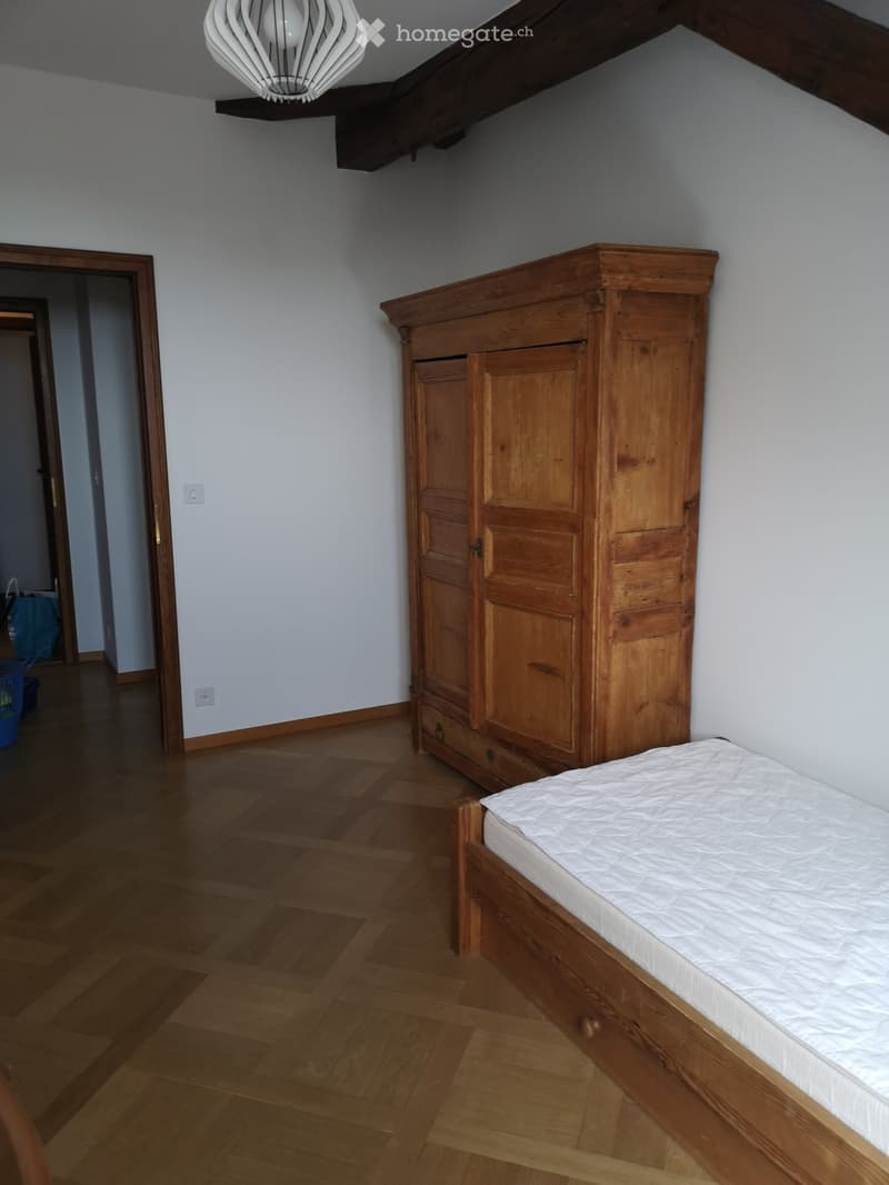 wooden bed, wooden cupboard, white wall, wooden floor, lamps