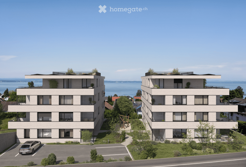 Two residential buildings with balconies, view of the lake and sky