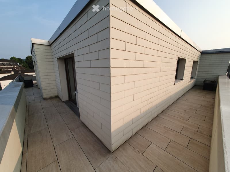 Roof terrace, wooden floor, white wall, balcony railing