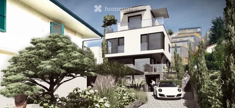 Modern two-story building with a balcony, surrounded by greenery and a parking area with a white sports car.